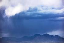 Storm clouds above mountains at the edge of Summerlin Sunday, May 16, 2021. Scattered thunderst ...
