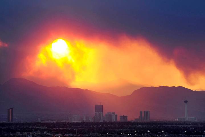 In a Review-Journal file photo, the Las Vegas skyline is seen as smoke continues to billow from ...