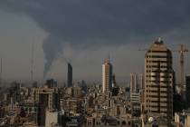 Huge smoke rises up from an oil facility facility after it appeared to have been hit by an Isra ...