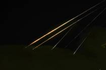 Traces of projectile illuminates the sky seen from northern Israel, Saturday, June 14, 2025. (A ...
