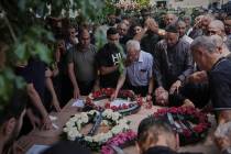 Relatives attend the funeral of four members of the Khatib family, Palestinian citizens of Isra ...