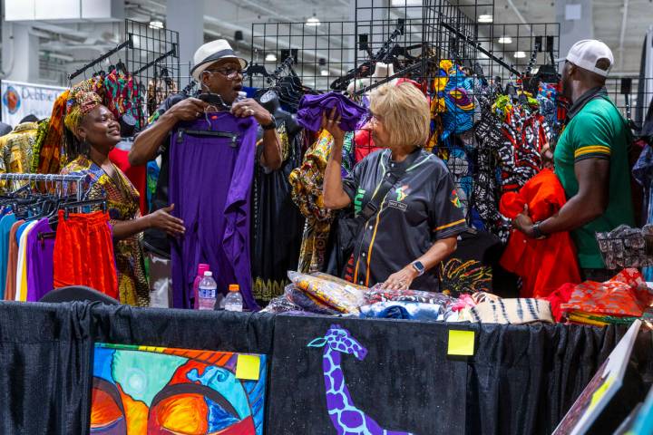 Mayor of North Las Vegas Pamela A. Goynes-Brown, center, shows off an item she likes to husband ...