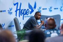 Former Raiders wide receiver Henry Ruggs listens to a question from an attendee while on hand t ...