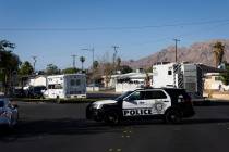 Metropolitan Police Department officers investigate the scene of a homicide at the 3600 Block o ...