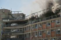 Smokes raises from a building of the Soroka hospital complex after it was hit by a missile fire ...