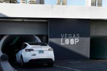 A Tesla enters an underground transportation system at the Westgate's Vegas Loop station, on Fr ...
