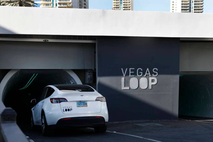 A Tesla enters an underground transportation system at the Westgate's Vegas Loop station, on Fr ...