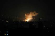 Smoke rises from an attack in Tehran, Iran, by Israel on Friday, June 13, 2025. (AP Photo/Vahid ...