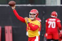 Kansas City Chiefs quarterback Patrick Mahomes throws a pass during the NFL football team's org ...