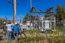 NV Energy and Gen-Tech crews work at the Kyle Canyon Substation as they prepare for a possible ...