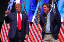 FILE - Republican presidential nominee former President Donald Trump speaks with Tucker Carlson ...