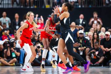 Aces center A'ja Wilson (22) grabs the ball during a scramble for possession of it during a WNB ...